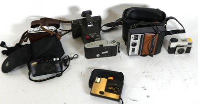 Lot 477 - A box of cameras, to include a Polaroid Super...