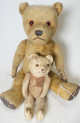 Lot 405 - An early 20th century blond mohair teddy bear...