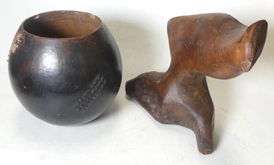 Lot 407 - An African terracotta vase of globular form,...