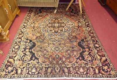 Lot 1159 - A Persian red, blue and cream ground woollen...