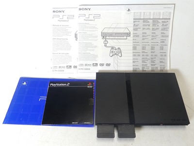 Lot 425 - A Playstation 2 Games Console, with manual,...