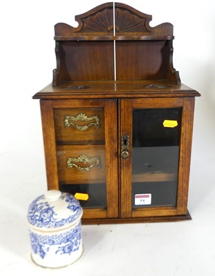 Lot 94 - An Edwardian oak smoker's cabinet, having a...