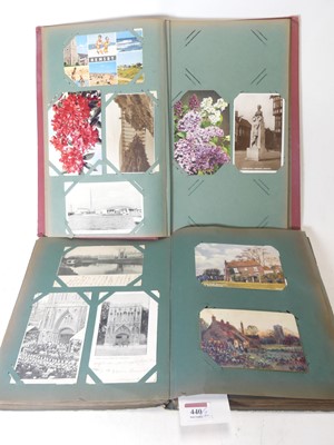 Lot 440 - An early 20th century postcard album and...