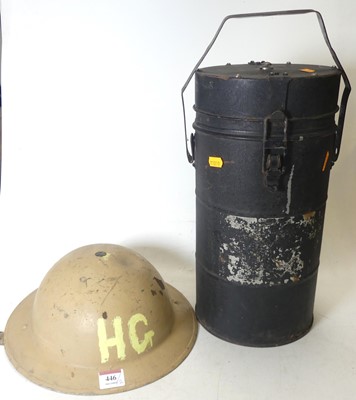 Lot 446 - A painted metal  helmet inscribed HG, with a...