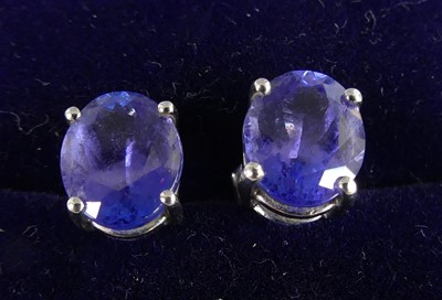 Lot 2284 - A pair of white metal and tanzanite stud...