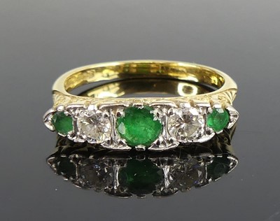 Lot 2260 - An 18ct gold and platinum, emerald and diamond...