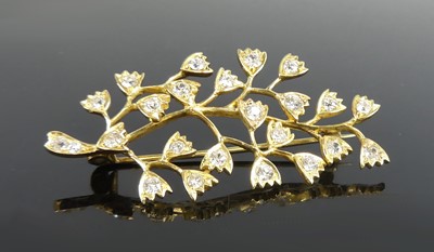 Lot 2240 - A yellow metal diamond foliate spray brooch,...