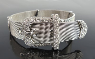 Lot 2344 - An 18ct white gold diamond belt style Milanese...