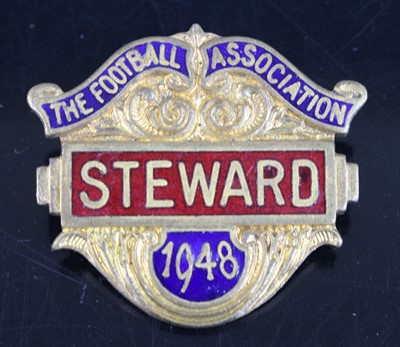 Lot 1532 - A gilt metal and enamelled Stewards badge for...