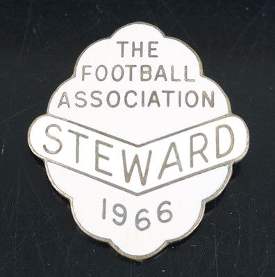 Lot 1533 - A gilt metal and enamelled Stewards badge for...