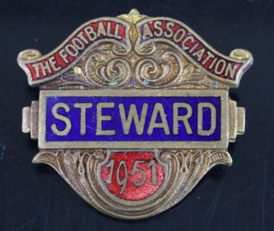 Lot 1534 - A gilt metal and enamelled Stewards badge for...