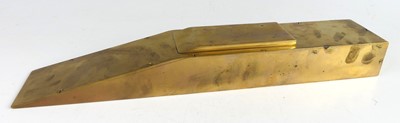Lot 161 - A well-made polished bronze door wedge, of...