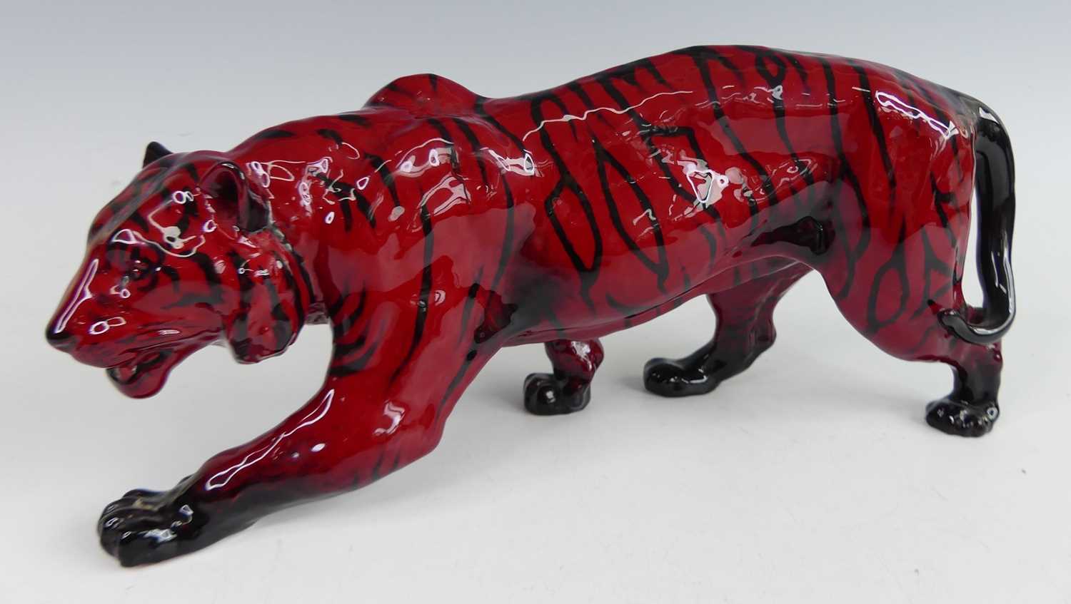 Lot 3 - A Royal Doulton glazed flambé ceramic model of...