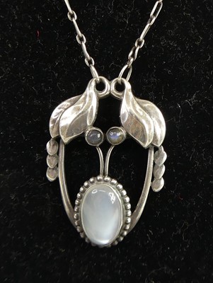 Lot 115 - Georg Jensen - an early foliate silver pendant,...