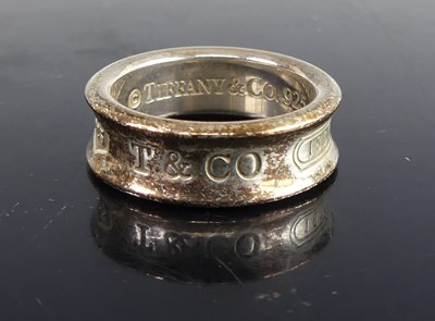 Lot 133 - Tiffany & Co - a sterling silver '1837' band...