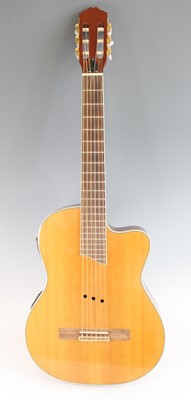 Lot 1374 - An Elan-4Tn electro acoustic guitar, in soft...