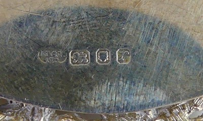 Lot 2102 - A collection of five silver decanter collars,...