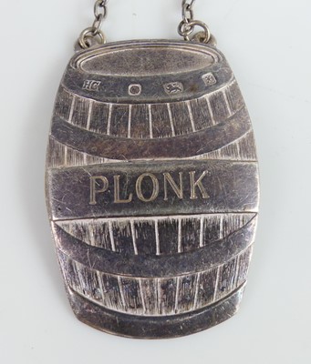 Lot 2102 - A collection of five silver decanter collars,...