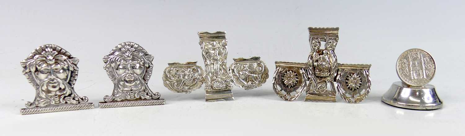 Lot 2104 - A collection of silver and white metal novelty...