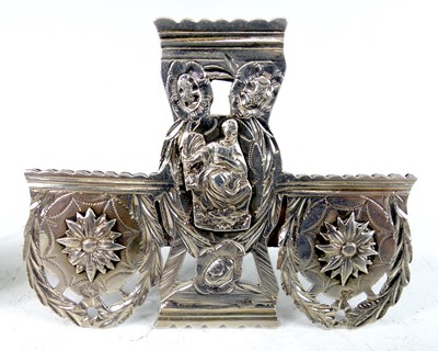 Lot 2104 - A collection of silver and white metal novelty...