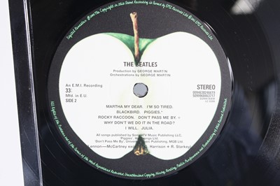 Lot 1017 - The Beatles - a collection of three re-issue...