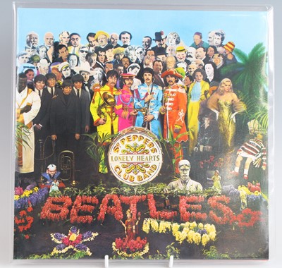Lot 1017 - The Beatles - a collection of three re-issue...