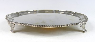 Lot 2175 - A George V silver card waiter, of shaped...