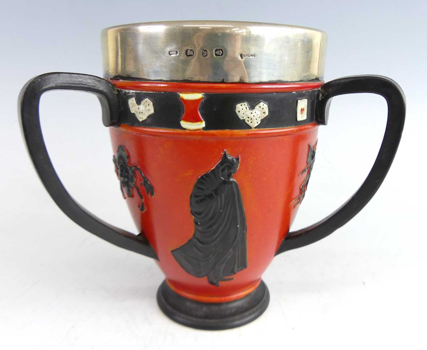Lot 2 - An unusual Doulton Lambeth pottery footed tyg,...