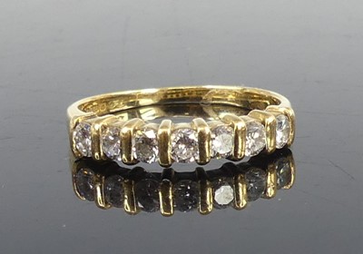 Lot 2643 - An 18ct yellow gold diamond half eternity ring,...