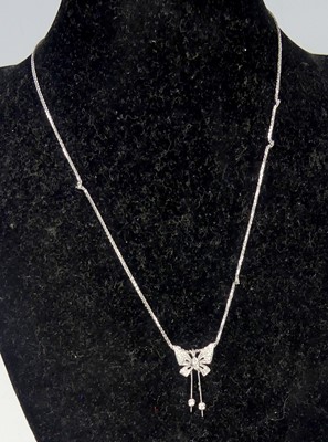 Lot 2675 - A new 18ct white gold diamond set butterfly...