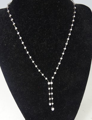 Lot 2676 - A new 18ct white gold diamond Riviere necklace...