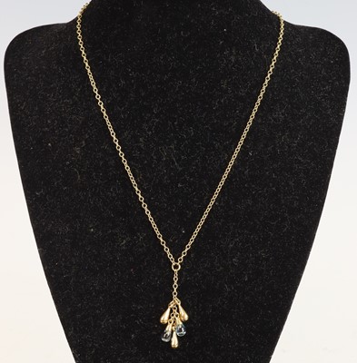 Lot 347 - A new 9ct gold and cabochon blue topaz pendant,...
