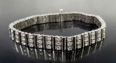 Lot 2540 - A new 18ct white gold diamond tennis bracelet,...