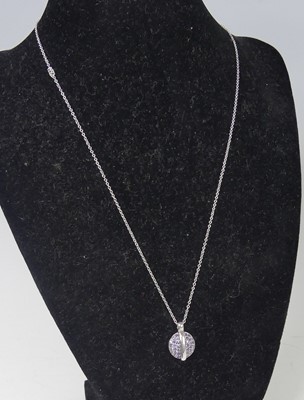 Lot 2516 - A new Fiorelli 9ct white gold iolite pendant,...