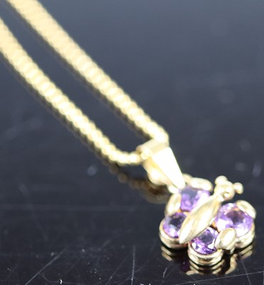 Lot 395 - A 9ct gold and amethyst set insect pendant, on...