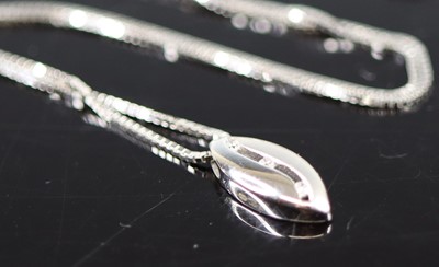Lot 385 - A new 18ct white gold three diamond set...