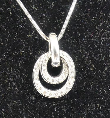 Lot 2322 - An 18ct white gold diamond multi-hoop pendant,...