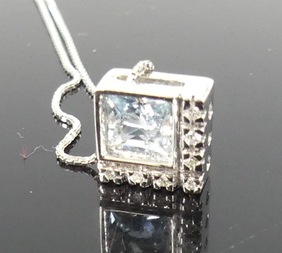 Lot 2271 - A white metal aquamarine and diamond pendant,...
