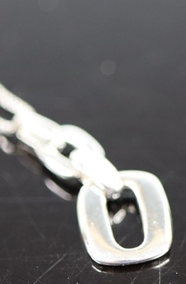 Lot 386 - A new 9ct white gold diamond set double link...