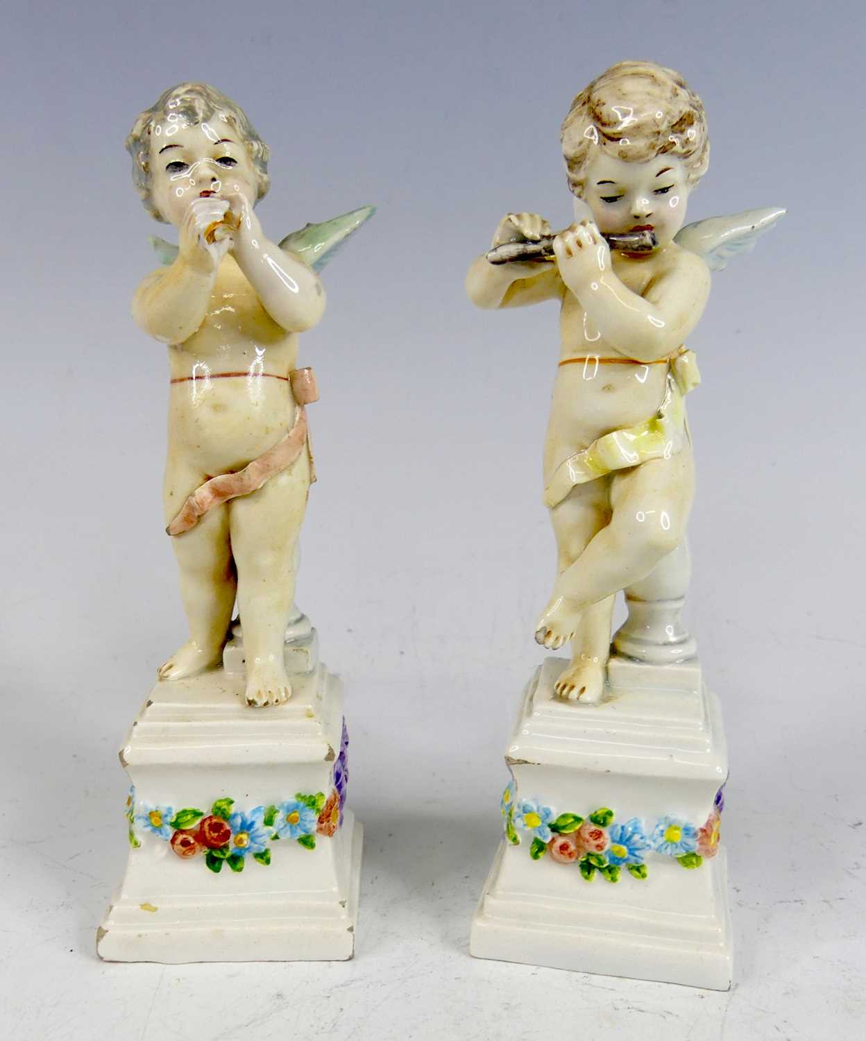 Lot 2046 - A pair of 18th century porcelain figures of...