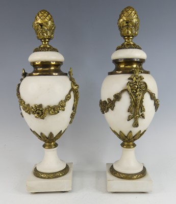 Lot 2404 - A pair of white marble and gilt metal mounted...