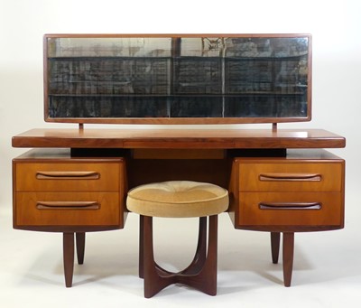 Lot 411 - A 1960s G-Plan 'Fresco' teak kneehole long...