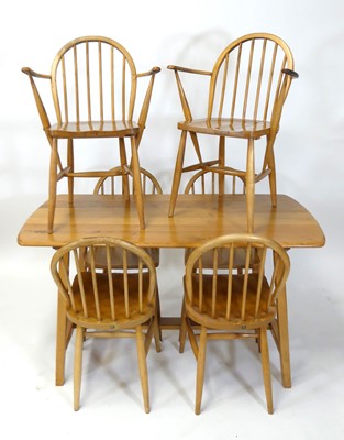 Lot 417 - A 1950s Ercol blond elm and beech 'Model CC 41'...