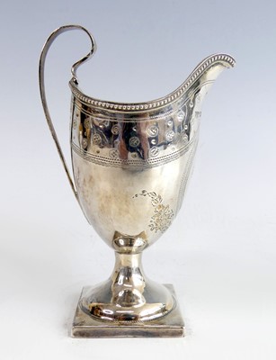 Lot 2133 - A George III silver helmet form cream...
