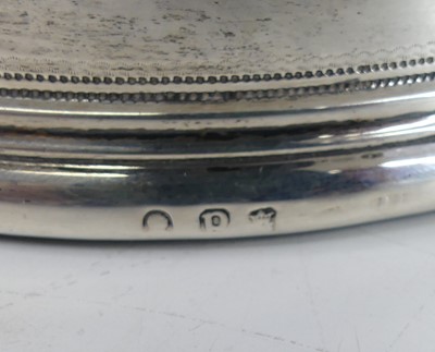 Lot 2109 - A pair of George III silver wine bottle...