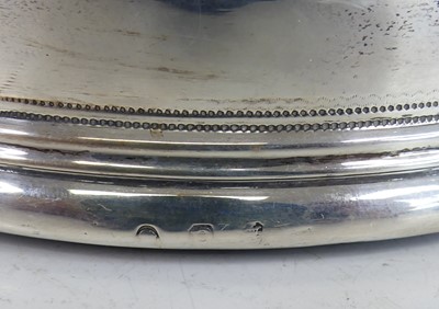 Lot 2109 - A pair of George III silver wine bottle...