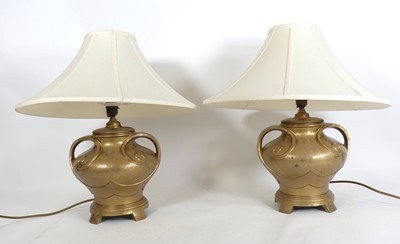 Lot 127 - A pair of gilt painted metal table lamps, of...