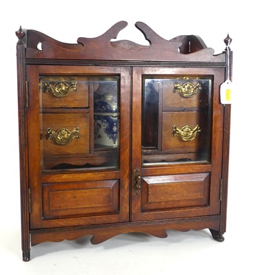 Lot 130 - An early 20th century oak smokers cabinet, the...