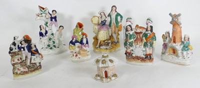Lot 161 - A group of seven Staffordshire pottery figures,...
