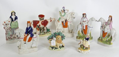 Lot 162 - A group of eight Staffordshire pottery figures,...